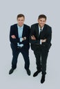 Two happy young businessmen full body, isolated on white. Royalty Free Stock Photo