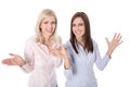 Two happy young businesswoman cheering with hands - isolated over white. Royalty Free Stock Photo