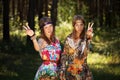 Two happy young fashion girls in a summer forest Royalty Free Stock Photo