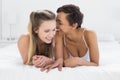 Two happy young female friends in bed Royalty Free Stock Photo