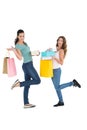 Two happy young female friends with shopping bags Royalty Free Stock Photo