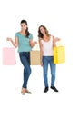 Two happy young female friends with shopping bags Royalty Free Stock Photo