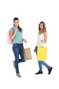 Two happy young female friends with shopping bags Royalty Free Stock Photo