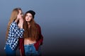 Two happy young girlfriends telling secrets. Girl Royalty Free Stock Photo