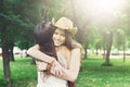 Two happy young girls hug each other in summer park Royalty Free Stock Photo