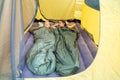 Two happy young girls lying in sleeping bags in a tent Royalty Free Stock Photo