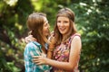 Two happy young girls in a summer forest Royalty Free Stock Photo