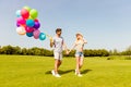 Two happy young lovers having date in the park Royalty Free Stock Photo