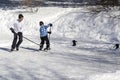 Two hasidim orthodox boys playing hockey on ice