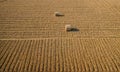 Two hay bales sit in a field of harvested crops Royalty Free Stock Photo