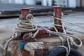 Two-headed mooring bitt wrapped with rope Royalty Free Stock Photo