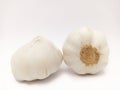 Two Heads of garlic on isolated white background, two fresh raw bulbs garlic put together, unpeeled garlic Royalty Free Stock Photo