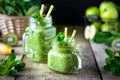 Two healthy green smoothie with spinach, banana, apple, kiwi and mint in glass jar. Royalty Free Stock Photo