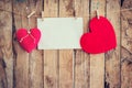 Two heart hanging and paper on clothesline and rope with wooden Royalty Free Stock Photo