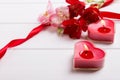 Two heart shape candles and flowers Royalty Free Stock Photo