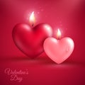 Two heart shape candles on red background