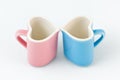 Two heart-shape cups on white background