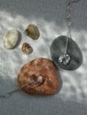 Two shiny glassy heart pendants on natural stones Royalty Free Stock Photo