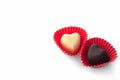 Two heart-shaped chocolates Royalty Free Stock Photo