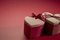 two heart shaped gift boxes sitting next to each other Royalty Free Stock Photo