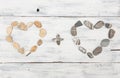 Two heart shaped pebble stones on a old wood Royalty Free Stock Photo