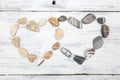 Two heart shaped pebble stones on a old wood Royalty Free Stock Photo