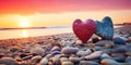 Two heart-shaped stones on a pebble beach, illuminated by the warm colors of a sunset. Generative AI. Royalty Free Stock Photo