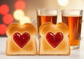 Two heart shaped toast with jam and drinks for valentine s day breakfast Royalty Free Stock Photo