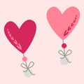 Two hearts with beads and a bow. Valentine card.