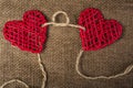 Two Hearts on burlap Background. Wedding Love Concept