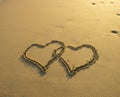 Two hearts drawn in beach Royalty Free Stock Photo