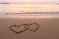 Two hearts drawn in beach Royalty Free Stock Photo