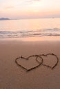 Two hearts drawn in beach Royalty Free Stock Photo