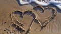 Two hearts drawn in the sand on a beach Royalty Free Stock Photo