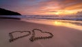 Two hearts drawn in the sand of a tropical beach at sunset Royalty Free Stock Photo