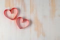 Two hearts made of ribbon on wooden background. Royalty Free Stock Photo