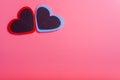 Two hearts on a pink background in the upper left corner. The concept of Valentine`s day Royalty Free Stock Photo