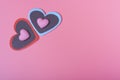 Two hearts on a pink background in the upper left corner and two small hearts. The Concept Of Valentine`s Day Royalty Free Stock Photo