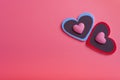 Two hearts on a pink background in the upper right corner and two small hearts. The concept of Valentine`s day Royalty Free Stock Photo