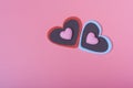 Two hearts on a pink background in the upper right corner and two small hearts. The concept of Valentine`s day Royalty Free Stock Photo