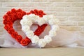 Two hearts. Red and white hearts with a pattern of roses Royalty Free Stock Photo