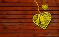 Two Hearts On Rustic Wooden table brown Background. 2 Heart Shape yellow with ropes in vintage wood, Love Concept Royalty Free Stock Photo