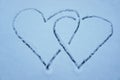 two hearts in the snow. intertwined hearts. background for Valentines Day. background for lovers. drawing hearts