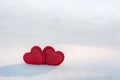Two hearts together on a  white snow. In love, Valentine`s Day, February 14 postcard Royalty Free Stock Photo