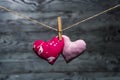 Two hearts together on wooden background Royalty Free Stock Photo