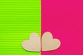 Two Hearts on the two-tone corrugated cardboard background. Green and pink trendy colors. Abstract geometric background. Valentin Royalty Free Stock Photo