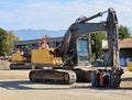 Two heavy excavators in the construction site during a redevelopment work.