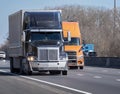 Two Heavy Trucks On Interstate