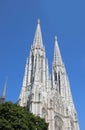 high bell towers of the VOTIVE CHURCH called Votivkirche in Vienna in Austria in central europe Royalty Free Stock Photo