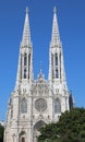 Two high bell towers of the VOTIVE CHURCH in Wien in Austria In Central Europe Royalty Free Stock Photo